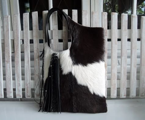 "BLACK WHITE TOTE with Woven Leather Tassels Calf Hair Bag with Hand Leather Cross Weave Country South Western Cowgirl Fur Bag Shoulder bag A personal favorite; beautifully soft to the touch. Wears easily over shoulder, stylish and luxurious. We carefully hand pick all cow hides ourselves; pre planning each piece and the best markings, so that every piece is unique & no two are ever alike.  The Megan Shoulder bag is perfect for your days out, extending beautifully into the evenings. The unique c Hair Bag, Western Bag, Shoe Chart, Cowhide Purse, Cowgirl Fashion, Large Silk Scarf, White Tote Bag, Black Cow, Fur Bag