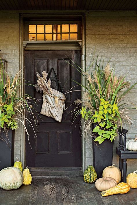 Front Porches That Have Us So Ready for Fall- Seasonal Greens Front Door Planters, Creative Pumpkin Decorating, Pumpkins And Gourds, Fall Front Porch Ideas, Door Planter, Southern Porches, Fall Containers, Porch Planters, Primitive Homes