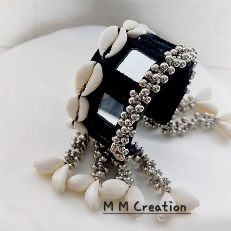 The beauty of fusion jewelry with our latest handcuff bracelet. Mirror details and cowrie shells create a perfect bohemian look 🪞✨ . For order dm us @m_m_creations_by_manali Or WhatsApp on +91 97029 09397 . Worldwide shipping available!🌏 Bulk order accepted ✨ . Affordable prices 🏷️ . #navratri2024 #navratrijewellery #reelsindia #explorepage #haldijewellery #handmadebangles #trendingreels #navratri #mmcreation #new #trending #viral ##viralpage #latestdesign #onlineshopping #vocalforlocal #N... Cowrie Shell Jewelry For Navratri, Haldi Favours, Mehndi Favours, Navratri Accessories, Navratri Ideas, Mehndi Jewellery, Return Gift Ideas, Wedding Return Gifts, Haldi Jewellery