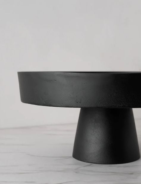 This clean-lined stand sets off your tabletop or counter with minimalist elegance. In a sleek black finish, this metal pedestal offers versatile appeal in both function and style, from centerpiece decor to a fresh offering of pastries or baked goods. Black Cake Stand, Ceramic Cake Stand, Cake Stand Ceramic, Black Cake, Decorative Stand, Lulu And Georgia, Black Ceramic, Wall Hooks, Display Stand