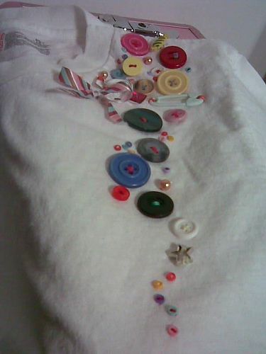 Button Tshirt  a button design i did on my plain white Hanes tshirt. Button Clothes, Decorative Buttons On Clothes, Diy Cloth Buttons, Button With Embroidery, Button Decorations On Clothes, Change Buttons On Shirt, Reworked Tshirt, Decorating Shirts, Tshirt Design Diy