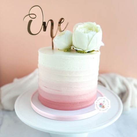 Floral pink ombré cake for celebrating one’s first birthday. #cake #pink #pinkcake #ombrecake #ombre #one #onecake #babycakes #peonies #floralcake Ombre First Birthday Cake, 1st Birthday Cake Flowers, Pink And White First Birthday Cake, Mauve Birthday Cake, Ombré Pink Cake, Rose Gold Smash Cake, Pink And White Smash Cake, Ombre Cake Pink, Light Pink Birthday Cake