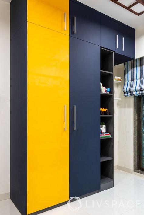 6 Wardrobe Colours That Will Give Your Bedroom a New Look Bedroom Cub Board Interior Design, Livspace Wardrobe, Bedroom Cabord Designs, Modern Wooden Cupboard Design, Wardrobes Designs, Wooden Cupboard Design, Bedroom 2022, Cupboard Colors, Wardrobe Laminate Design