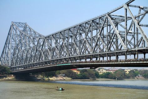 KOLKATA, INDIA Howrah Bridge. KOLKATA, INDIA - MARCH 13: Fisherman boat crosses #Sponsored , #SPONSORED, #Ad, #Howrah, #KOLKATA, #boat, #Bridge Howrah Bridge, Victoria Memorial, Army Images, Famous Bridges, Bridge Photography, Romantic Escapes, India Tour, Famous Landmarks, Historical Place