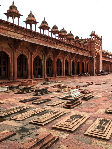 Fatehpur Sikri was built between 1571 and 1585 and encompassed a grand palace, courtyards, gardens, gazebos, ceremonial gates, an artificial lake, and a large mosque, with most of the buildings being constructed out of local red sandstone. The city’s name, “Fatehpur,” meaning “City of Victory,” commemorates Akbar’s triumphant Gujarat campaign in 1573. Indian Maximalist, Courtyards Gardens, Fatehpur Sikri, Mughal Emperor, Red Sandstone, Mughal Architecture, Grand Palace, Artificial Lake, Mughal Empire