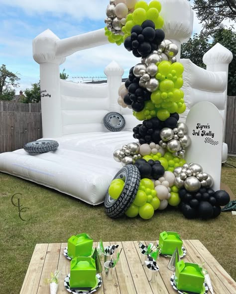 Lime Green Balloon Garland, Balloons On Bounce House, Monster Truck Balloons, Monster Truck Balloon Arch, Monster Truck Birthday Decor, Black Balloon Decor, White Bounce House With Balloons, Bounce House Balloon Garland, Monster Truck Birthday Party Decorations