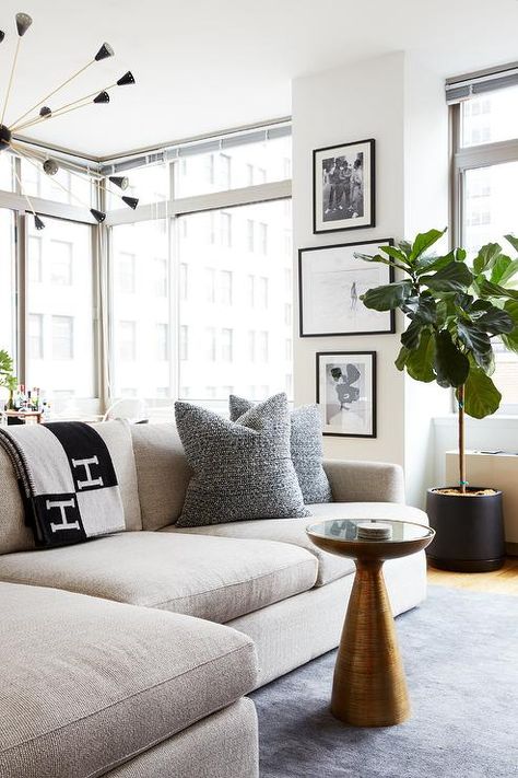 Cozy high rise living room is furnished with a mushroom linen sectional draped in an Hermes Avalon Blanket and topped with black pillows. Dark Stained Wood Floors, Hermes Blanket, Linen Sectional, Jute Rug Living Room, Black Living Room, Black Pillows, Linen Sofa, Room Interior Design, Pictures Ideas