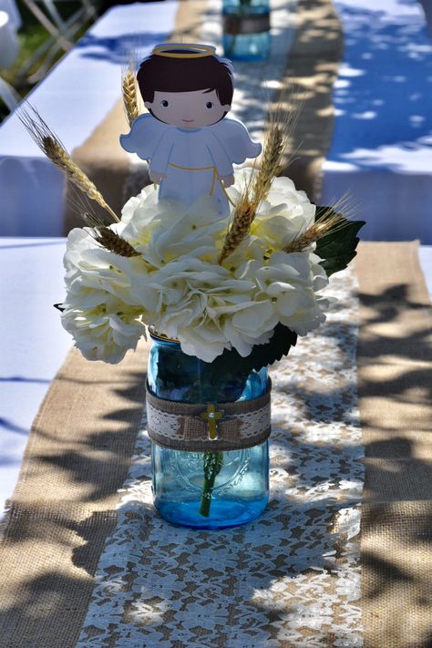 DIY Baptism centerpieces for boy. Tinted mason jars from the dollar tree. Centros de mesa para bautizo. Bautizo Ideas Boy Centerpieces, Diy Baptism Centerpieces, Charro Bautizo Centerpieces, Bautizo Centerpieces For Boys, Baptism Centerpieces For Boys, Bautizo Ideas Boy Decoration Charro, Baptism Flower Centerpieces Boy, Charro Party, Christening Centerpieces