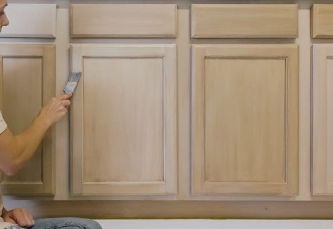 Revamp Your Kitchen Cabinets with a Wooden Twist: A DIY Transformation Guide Paint Wash Kitchen Cabinets, Paint Washed Kitchen Cabinets, Lighten Kitchen Cabinets, Lighten Cabinets, Restaining Cabinets Kitchens, Painted Kitchen Cabinets Diy, How To Glaze Kitchen Cabinets, White Kitchen Cabinets Makeover, How To Paint Cabinets To Look Like Wood