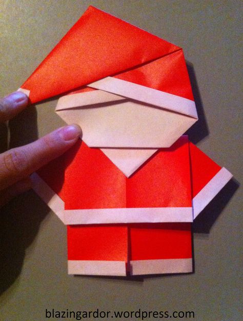 Origami Santa - How to guide as requested by Meredith :) Santa's Head 1. Get a standard size origami paper, red on one side, plain on the other. 2. Fold one edge in 1/2cm 3. Fold joining side 1/2 c... Santa Origami, Origami Santa Claus, Origami Santa, Origami For Beginners, Origami Dragon, Origami Fish, Origami And Kirigami, Folding Origami, Instruções Origami