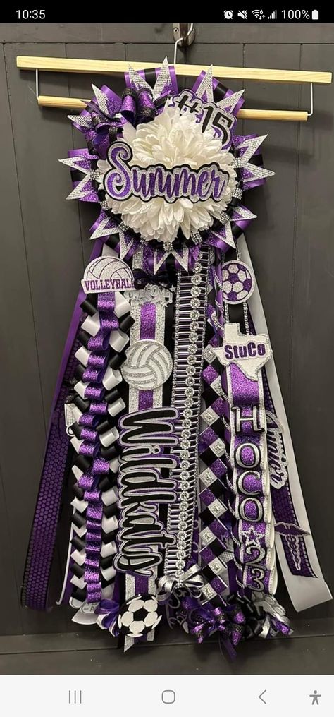 Purple White And Silver Homecoming Mums, Homecoming Garter Ribbon Length, Homecoming Mum Ideas Texas, Hocoming Mum Ideas, Homecoming Mum Head Ideas, Purple And White Mums Homecoming, Purple And Gold Homecoming Mums, Purple And Gold Mums Homecoming, Junior Year Mum Ideas