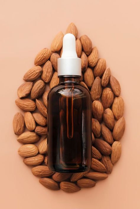 Is almond oil good for hair? Experts break down the benefits of almond oil for hair, plus how to use almond oil for hair and the best almond oil products to try. #beautytips #haircaretips #haircolor #hairstyle #almondoil Almond Oil Photography, Argan Oil Aesthetic, Natural Hair Care Aesthetic, Hair Oil Product Photography, Hair Product Business, Hair Oil Photography, Hair Oil Aesthetic, Hair Oil Benefits, Oil Photography