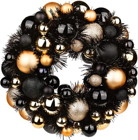 Black Wreath Christmas, Gold Black Christmas Decor, Black And Gold Ornaments, Tv Stand Christmas Decor, Black Christmas Wreath, Black And Gold Christmas Decor, Christmas Decorations Black, Gold Ornament Wreath, Christmas Ball Wreath