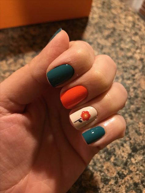 Fall nails - dark aqua & orange with flower design. Dark Orange Nail Designs, Dark Teal And Orange Nails, Aqua And Orange Nails, Dark Teal Nails Designs Fall, Dark Green And Orange Nails, Teal And Orange Nail Designs, Orange Teal Nails, Teal Orange Nails, Fall Teal Nails