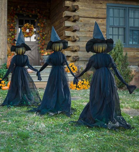 Nothing says Halloween like a trio of spooky witches ominously loitering in the yard. Covered in wispy fabric, these witches get staked into the ground 24 apart. When the sun goes down, click the on/off switch to illuminate their faces so they can greet trick-or-treaters! The set requires three button cell batteries (included); witches are approx. 12L x 7W x 52H each and connected like they're holding hands. Entrada Halloween, Dekorasi Halloween, Casa Halloween, Halloween Witch Decorations, Witch Garden, Diy Halloween Decor, Adornos Halloween, Halloween Tattoo, Halloween Witches