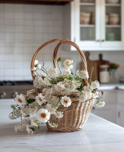 Fresh flowers bring a touch of nature’s serenity right to your kitchen, creating that perfect cozy home vibe. This charming wicker basket with flowers symbolises a peaceful and inviting space. Let this scene inspire you to bring the simple elegance of nature into your home, enhancing the warm and welcoming atmosphere. #CozyHomeVibes #HomeDecor #FlowerBasket #KitchenStyle #HomeInspiration #NaturalDecor #SerenityAtHome #InteriorDesign #FreshFlowers #CountryChic #MarbleCountertops #HomeStyling Artsy Design, Artificial Flowers And Plants, Marble Countertops, Flower Basket, Nature Decor, Country Chic, Simple Elegance, Kitchen Style, Wicker Baskets