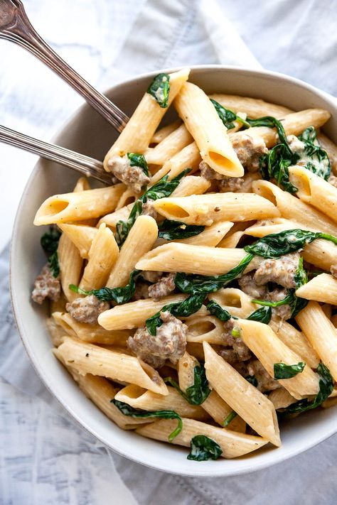 Creamy Italian Sausage Pasta - pasta with sausage and spinach in the creamiest, garlicky parmesan sauce. Pure comfort food on the table in under 30 minutes! #pasta #recipe #easy #quick #under30minutes #easydinner #easyrecipes #sausage #creamy #weeknight #datenight Creamy Italian Sausage Pasta, Lasagna Recipe Videos, Spinach Sausage, Spinach Artichoke Pasta, Pasta Spinach, Classic Lasagna Recipe, Sausage And Spinach, Sausage Ingredients, Sausage Pasta Recipes