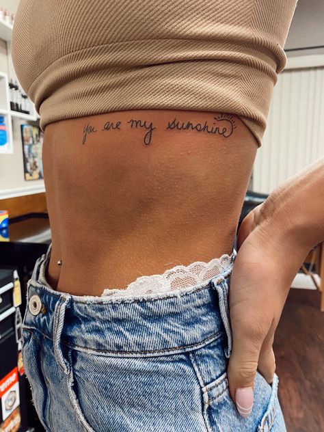 Side Tattoos With Meaning, Simple Classy Tattoos For Women, Tattoos You Are My Sunshine, Mom And Daughter Tattoos You Are My Sunshine, Country Meaningful Tattoos, Cute Tattoos On Ribs, Your The Sun To Me Tattoo, Mother Daughter Tattoos Ribcage, Tattoos For Losing Your Mom