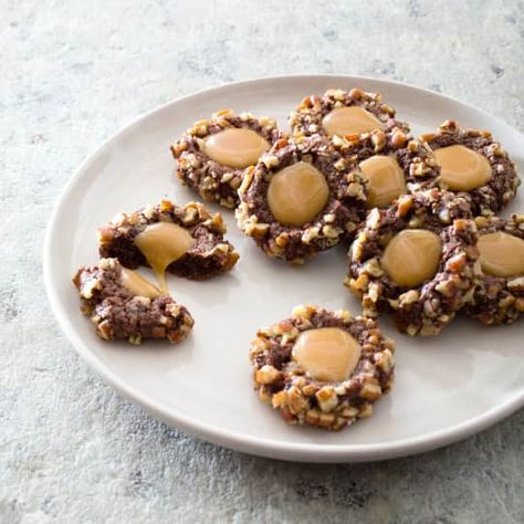 Chocolate Turtle Cookies | America's Test Kitchen Chocolate Turtle Cookies, America Test Kitchen, Chocolate Turtle, Pecan Turtles, Thumbprint Cookie, Donut Toppings, Caramel Chocolate Bar, Cooks Country, Cookie Toppings