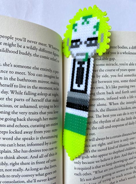 Beetlejuice! Beetlejuice! Beetlejuice!  Bookmark made by hand from mini perler beads All Might Perler Beads, Ouija Board Perler Beads, Perler Bead Book Mark Patterns, Beetlejuice Perler Bead Patterns, Book Perler Beads, Beetlejuice Perler, Bookmark Perler Beads, Perler Bead Bookmarks Pattern, Barbie Perler Beads