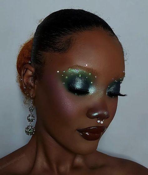 Pearlescent Makeup Looks, Green Eye Makeup With Rhinestones, Green Ivy Makeup, Green Holiday Makeup, Spiritual Makeup Looks, Elphaba Makeup Eye, Dark Green Fairy Makeup, Green Pearl Makeup, Jewel Tone Makeup Looks