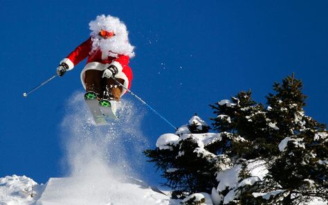 Dressed in a Santa Claus costume, ski teacher Alberto Ronchi jumps at Madonna di Campiglio in northern Italy, pic: Reuters/ Stefano Rellandini Ski Teacher, Andorra Ski, Skiing Christmas, Santa Claus Costume, Ski Holidays, Christmas Costume, Merry Christmas To All, Snow Scenes, Very Merry Christmas