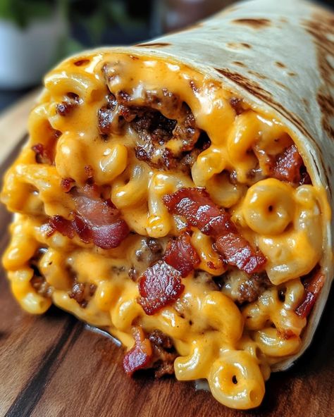 Bacon Macaroni Cheeseburger Wrap 🌯 Ingredients: - 1 lb ground beef - 2 cups cooked macaroni - 6 strips bacon, cooked and crumbled - 1 cup shredded cheddar cheese - 1/4 cup ketchup - 1/4 cup mustard - 4 large flour tortillas Instructions: 1. Cook the ground beef in a skillet over medium heat until browned, breaking it apart with a spoon. Drain excess fat. 2. Mix in the cooked macaroni, crumbled bacon, shredded cheddar cheese, ketchup, and mustard. Stir until well combined and the ch... Bacon Macaroni Cheeseburger Wrap, Recipe With Velveeta, Bacon Mac N Cheese Burger Wrap, Loaded Bacon Cheeseburger Tacos, Cheesy Bacon Burger Wraps, Bacon Mac And Cheese Burger Wrap, Bacon Cheeseburger Wraps, Viral Food Trends, Morning Food Ideas