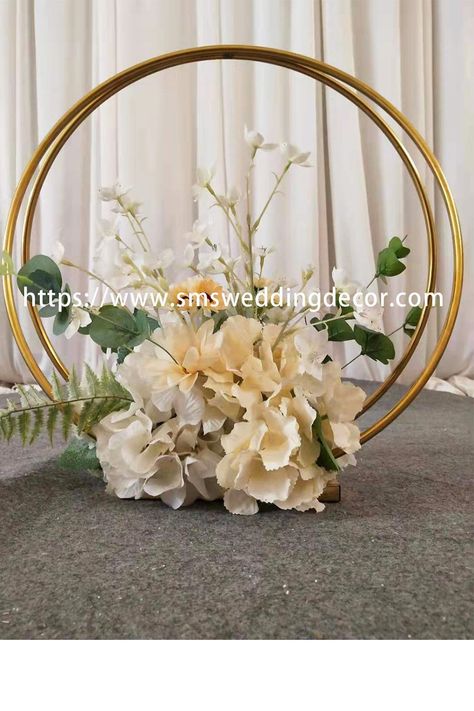 Floral Hoop Centerpieces This gold hoop centerpiece is a best-selling wedding centrepiece, delicate and small. The circle centerpieces wedding is made of stainless steel and plated in gold for a shiny, textured finish. Its two identically sized rings are approximately 50cm in diameter and are fixed side-by-side on a stainless steel base. White Peonies Centerpiece, Flower Runner, Peonies Centerpiece, Red Rose Flower, Floral Hoops, Fairy String Lights, White Backdrop, White Peonies, Flower Stands