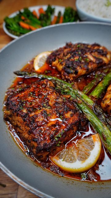 Kay on Instagram: "CAJUN WHITE FISH & ASPARAGUS IN A SPICY GARLIC BUTTER SAUCE, WHITE RICE AND VEG💣💥🔥🚀🏆💯🌋🎉🧨. The tastiest, quick and easy Cod filets, that are rubbed with an amazing spice mixture before grilling to perfection. Then cooked in the most IRRESISTIBLE spicy garlic butter sauce with Asparagus. All comes together in 25 MINUTES. In the recipe I also show the trick to keep the fish together. THE BEST FISH RECIPE TO DATE!!! NO JOKE!! 💯🥳🤤. . . DM FOR MORE INFO TO GET MY DAILY R Spicy White Fish Recipes, Hot Honey White Fish In A Garlic Herb Butter Sauce, Cajun Cod Recipes, Whiting Fish Recipes, Spicy Garlic Butter Sauce, Lunch Nyc, Cajun Fish Recipes, Cajun Fish, Cod Filets