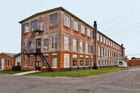 A 19th century factory in Geneva, New York, is both home and workshop for furniture designers Amy and Brandon Phillips. Purchased in 2007 for $137,000, they've worked steadily ever since at turning it into the fascinating industrial chic space you see here. More here on Dwell. Factory Exterior, Warehouse Renovation, Factory House, Warehouse Living, Warehouse Loft, San Myshuno, Warehouse Conversion, Brick Siding, Factory Architecture