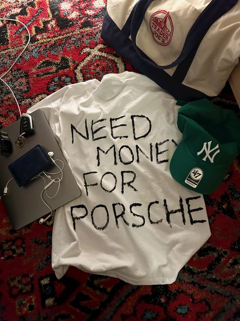 need money for porsche white t-shirt forest green baseball cap ny yankees blue Louis Vuitton wallet trader joes bag apple MacBook earbuds rug aesthetic Porsche Shirt, Need Money For Porsche, Need Money, Old Money, Classic White, Fitness Inspo, Graphic Shirts, Mood Pics, Aesthetic Pictures