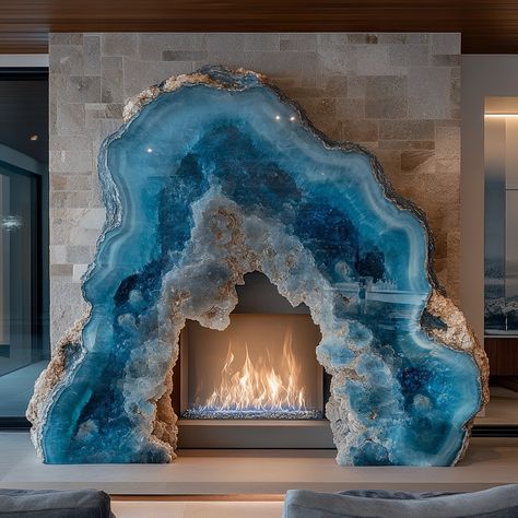 A geode fireplace is a stunning centerpiece that blends the natural beauty of geology with the warmth and comfort of a modern hearth. Crafted to mimic the intricate formations found inside geodes, the fireplace features a crystalline interior that shimmers with vibrant hues when illuminated by the flickering flames. The exterior is rugged and textured, resembling the raw outer shell of a geode, while the inside reveals a dazzling array of crystals, offering a captivating contrast. Perfect for... Geode Fireplace, Crochet Geode, Modern Hearth, Aqua Garden, Giant Crystal, Geode Decor, Blue Geode, Pinterest Ideas, Dreamy Room