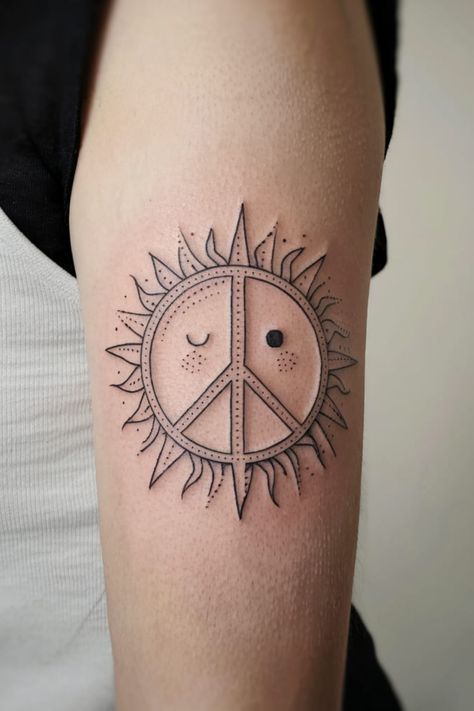 Combine the peace sign with a small sun for a tattoo that radiates warmth and positivity. This design is perfect for your shoulder or upper arm, reminding you to shine bright and spread peace wherever you go. Peace Tattoo Designs, Peace Tattoo, Water Lily Tattoos, Peace Tattoos, Celestial Tattoo, Peace Light, Goth Tattoo, Lily Tattoo, Peonies Tattoo