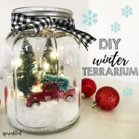 In this tutorial, I'm sharing how to make an easy, retro farmhouse-inspired light up winter terrarium that will be perfect for your Christmas decor. Winter Terrarium, Christmas Jars Decorations, Mason Jar Christmas Decorations, Christmas Lights Inside, Fairy Lights In A Jar, Christmas Fairy Garden, Mason Jar Christmas Crafts, Jar Projects, Christmas Workshop