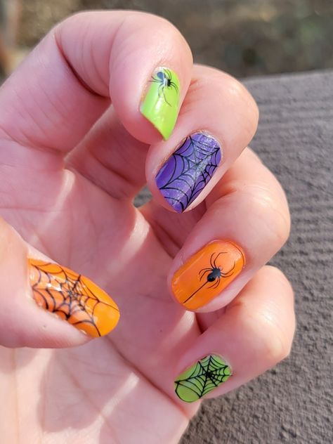 Multi Color Halloween Nails, Purple Green Orange Nails, Orange Purple Green Nails, Orange Black Purple Green Halloween Nails, Color Street Halloween Mixed Mani, Orange And Green Halloween Nails, Halloween Nails Green And Purple, Purple And Orange Nails Halloween, Halloween Nails Color Street