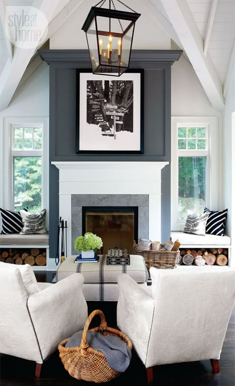 In the living room, a striking fireplace with a towering chimney breast and an oversized lantern-style pendant light are simple yet equally dramatic features. Real Estat, Modern Cottage, Fireplace Makeover, Fireplace Design, Style At Home, A Living Room, Design Case, Living Room Inspiration, A Fire