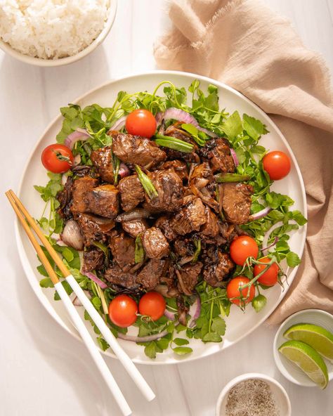 This peppery, sweet, and savory bo luc lac recipe (Vietnamese shaking beef) on a bed of crisp watercress, red onions, and cherry tomatoes is the easiest yet most luxurious Vietnamese dish. This quick and easy authentic Vietnamese shaking beef recipe is perfect if you want to treat yourself to a restaurant-quality dish at home! Authentic Vietnamese Food, Bo Luc Lac Recipe, Bo Luc Lac, Shaken Beef, Shaking Beef, Cherry Tomato Salad, Authentic Asian Recipes, Marinated Beef, Asian Grocery