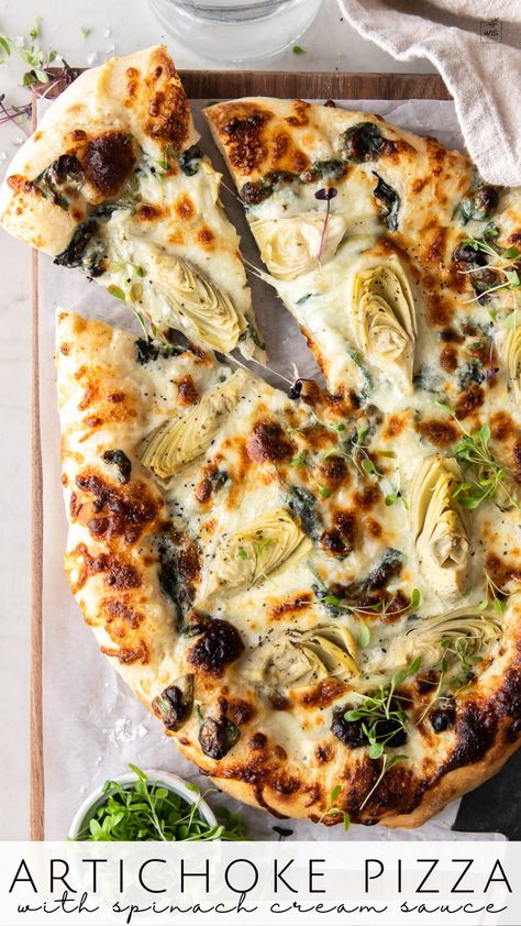 This artichoke pizza recipe is layered with a creamy parmesan spinach sauce, mozzarella, pecorino and tender marinated artichoke hearts. The chewy pizza dough is blistered in a super hot oven for the artichoke pizza every time! Follow me on Pinterest for more recipes like this! Alredo Sauce, Pizza With Spinach, Spinach Artichoke Pizza, Spinach Cream Sauce, Creamy Spinach Sauce, Parmesan Spinach, Marinated Artichoke Hearts, Spinach Parmesan, Artichoke Pizza