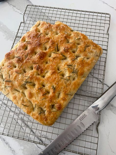 Focaccia rosemary bread knife fresh Foccacia Bread Aesthetic, Focaccia Aesthetic, Garlic Rosemary Focaccia, Foccacia Bread Pretty, Easy Rosemary Foccacia Bread, Focaccia Bread Photography, Rosemary Foccacia, Wild Garlic Confit & Rosemary Focaccia, Rosemary Bread