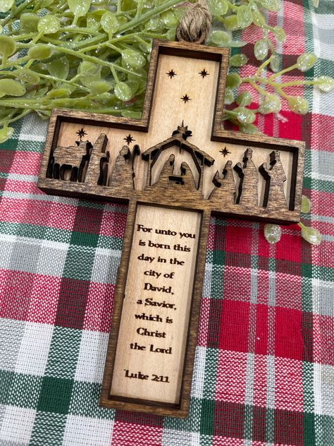 We love this Cross Ornament. it has such small detail. Everytime I look at the Little Shepherd staffs I am amazed at the small cuts in the wood. It all leads to Jesus in the Manger. Lazer Christmas Ideas, Laser Engraving Ideas Projects Woods, Christmas Engraving Ideas, Laser Cut Christmas Ideas, Lazer Engraver Ideas, Scripture Christmas, Wood Christmas Projects, Luke 2 11, Christian Christmas Gift