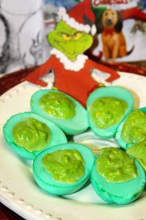 This simple but fun recipe Grinched Eggs is my green take on Deviled Eggs. My kids love em' and got a kick out of the green eggs and filling. Even better, they take only a few minutes to make and are a hit at parties! Grinch Deviled Eggs, Grinch Whobilation, Green Deviled Eggs, Green Food Party, Colored Deviled Eggs Recipe, Colored Deviled Eggs, Movie Dinner, Christmas Party Snacks, The Grinch Who Stole Christmas