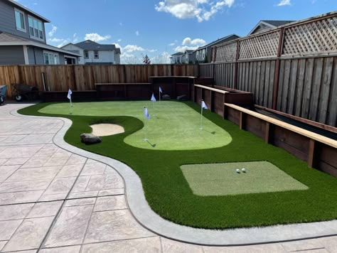 Backyard Playground Turf, Turf Area Backyard, Mini Putt Putt Backyard, Turf Landscape Ideas, Diy Putt Putt Course, Backyard Golf Green, Chipping Green Backyard, Backyard Putt Green, Backyard Chipping Green