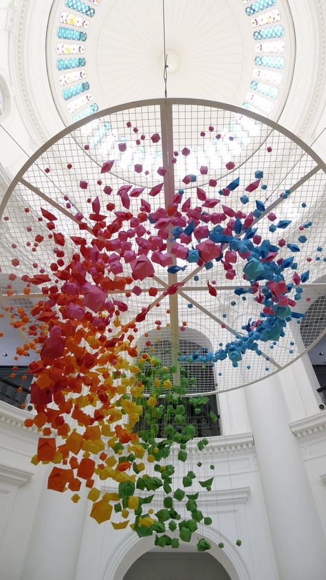 Giant, rainbow hanging installation of 1,000 origami spheres, fish and boats | Creative Boom Ceiling Art Installation, Origami Installation, Colorful Objects, Suspended Art, Paper Installation, Origami Boat, Ceiling Art, Art Installation, Origami Art