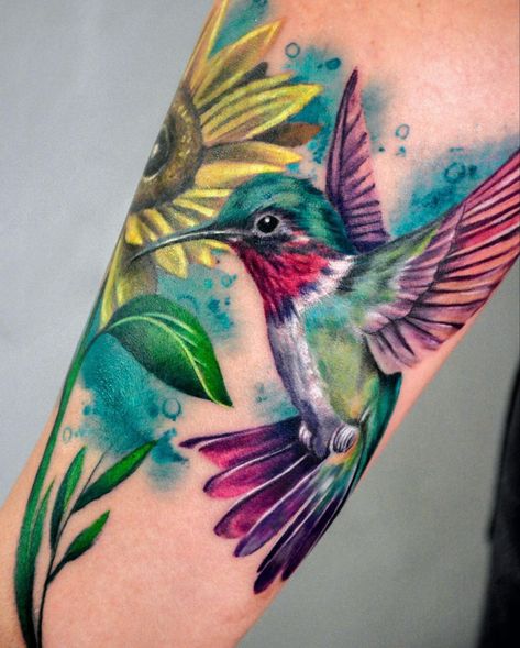 Download My FREE Tattoo eBook Featuring 300+ Unique Tattoo Designs! Visit! :- https://4shambhusah.systeme.io/9df35163 Hummingbird Tattoo Coverup, Hummingbird Watercolor Tattoo, Color Hummingbird Tattoo, Hummingbird Tattoos For Women, Bright Colorful Tattoos, Hummingbird Tattoo Watercolor, Colorful Hummingbird Tattoo, Best Feminine Tattoos, Hummingbird Flower Tattoos