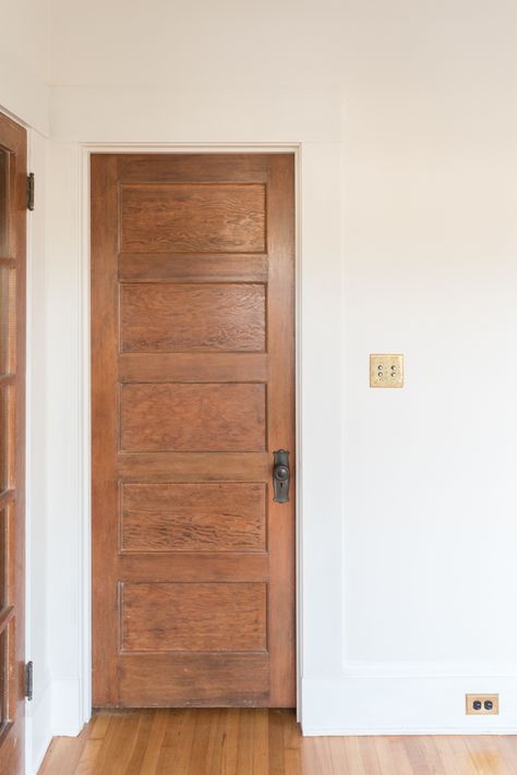 Wood Doors With Wood Floors, Light Wood Trim Farmhouse, Wood Door White Trim Interior, Old Farmhouse Wood Trim, 1920s Wood Trim, Brown Door White Trim, Wood Trim Doors, Wood Doors With Painted Trim, Interior Doors Stained Wood