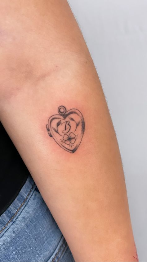 Memorial Tattoo For Friend, Best Friend Locket Tattoo, American Traditional Locket Tattoo, Back Elbow Tattoo Women, Small Locket Tattoo, Key And Locket Tattoo, Locket Initial Tattoo, Locket Tattoo With Initials, Cute Traditional Tattoos For Women