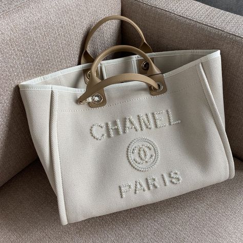 SHOP MORE LUXURY PRODUCTS HERE Description Chanel Deauville Tote Tweed Bag Summer Collection White For Women 15.7in/40 cm Measurements: 40 x 22 x 30 cm / 15/7 x 8.6 x 11.8 inches (Length x Width x Height) ChainWhiteGold-toned hardware Include dust bag.This product is of the premium quality. Chanel Shopping Bag, Chanel 22, Tote Bag Chanel, Chanel Bags, White Bag Outfit, Luxury Tote Bags, Chanel Tote Bag, Tweed Bag, Louis Vuitton Shirt