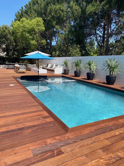 27 Stunning Pool Deck Ideas 2024: Transform Your Backyard Oasis - placeideal.com Swimming Pool Decking Ideas, Inground Pool With Deck, Pool Wood Deck, Deck Colours, Wooden Pool Deck, Concrete Decks, Wood Pool Deck, Decks Around Pools, Luxury Pools Backyard