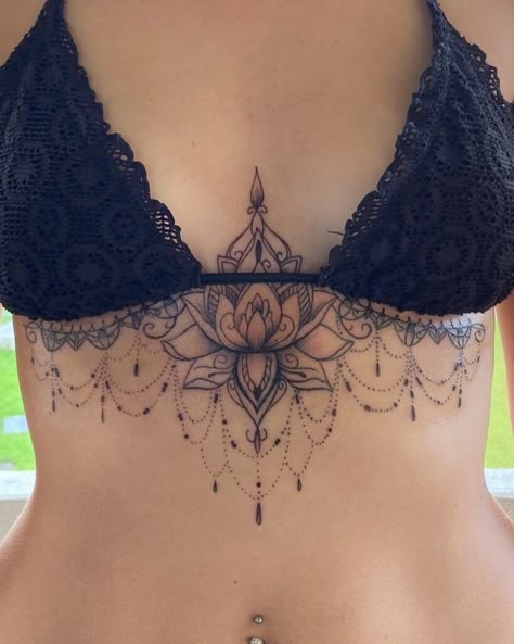 23 Under Breast Tattoo Ideas For The Bravest Women Mandala Sternum Tattoo, Lotus Chandelier, Sternum Tattoo Ideas, Underboob Tattoo Designs, Sternum Tattoos, Underboob Tattoo, Chest Tattoos For Women, Geniale Tattoos, Lotus Mandala