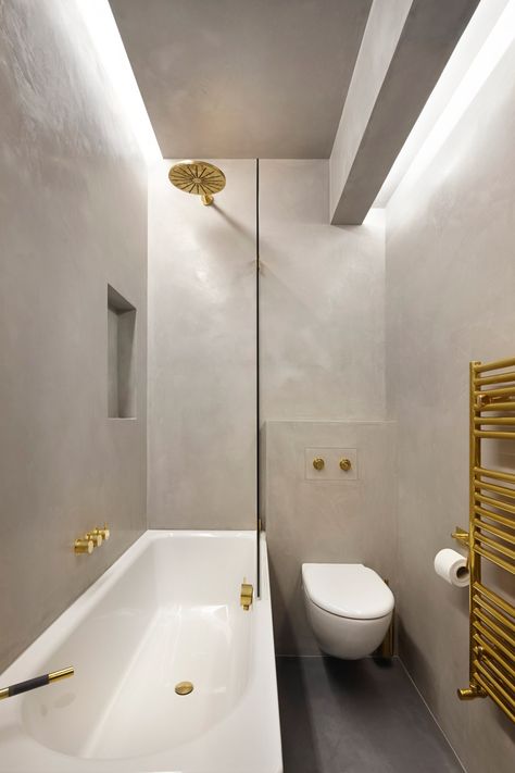 Rise Design Studio renovates flat inside a 19th-century London mansion block Gold Interior Design, Windowless Bathroom, Boutique Bathroom, London Mansion, Bold Bathroom, Basement Bathroom Ideas, Modern Basement, Dropped Ceiling, Gold Interior